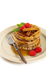 Waffles with raspberries and cinnamon. Selective focus.