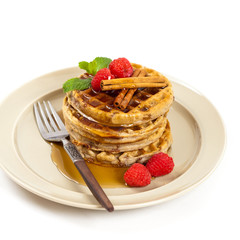 Waffles with raspberries and cinnamon. Selective focus.