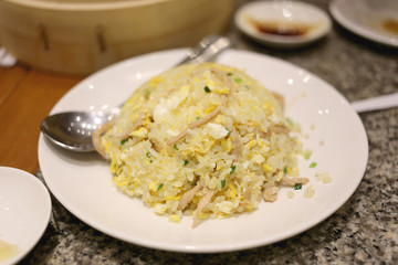 Fried rice on white dish.