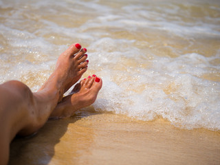 closeup of woman feet on the beach