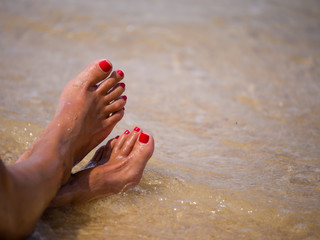 closeup of woman feet on the beach