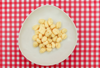 Gnocchi plate on Red and white checkered table