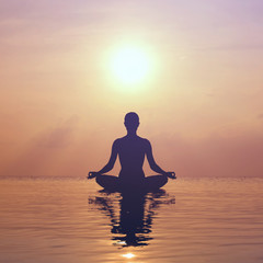 Silhouette young woman practicing yoga