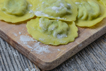 Spinach Ravioli on a Wood Cutting Board