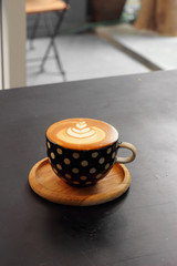 close up hot latte on black table