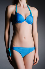 Fototapeta na wymiar Attractive woman in blue bikini