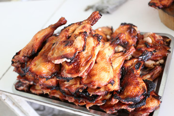 Grilled chicken on the foods table.