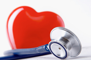 A heart with a stethoscope lying