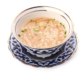 Bowl of chicken soup with vegetables and noodles