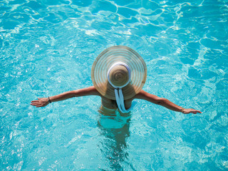 Caucasian model playing into clear water