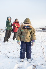 children mock child outdoors in winter on the street