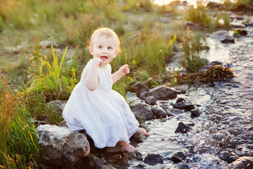 little girl and creek