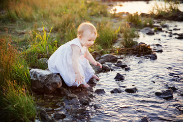 little girl and creek