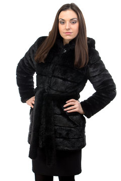 Photo of brunette in fur coat with hood