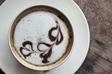 Espresso coffee hot in white glass.