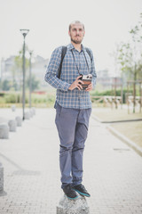 handsome hipster casual multitasking modern man with vintage cam