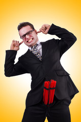 Businessman with dynamite isolated on white