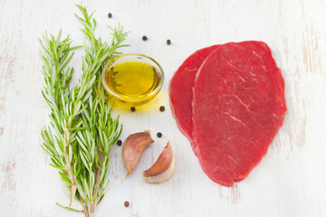 meat with rosemary, oil and garlic