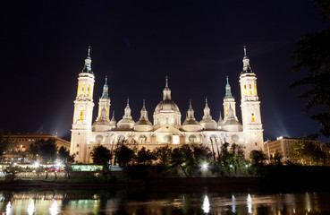 Fototapeta na wymiar Basilica Del Pilar in Zaragoza in night illumination, Spain