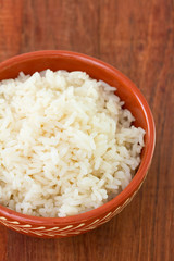 boiled rice in brown ceramic bowl