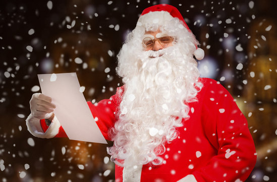 Santa Claus reading a letter