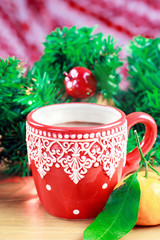 Cup of hot cocao with pine citrus and tangerine