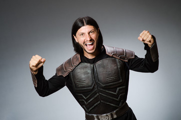 Angry warrior against dark background