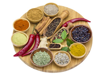 Variety of spices on wooden board