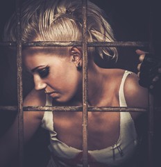 Troubled teenager girl behind bars