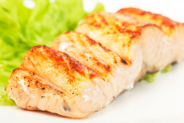 grilled salmon on white plate