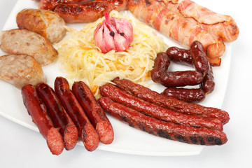 Grilled sausage with sauce and vegetables