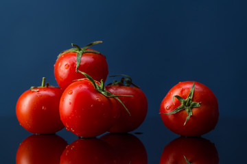 tomatoes on a dark background