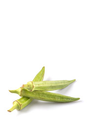 Okra or ladies' fingers vegetables over white background