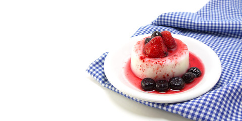 milk pudding dessert with strawberry and blue berry