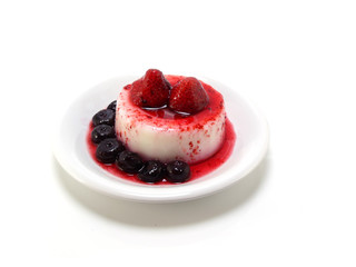 milk pudding dessert with strawberry and blue berry