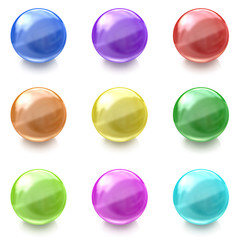 Set of colorful glass balls on white background