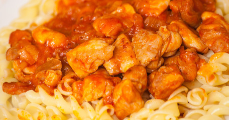 Fusilli pasta with chicken in tomato sauce