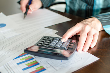 Female accountant checking financial documents