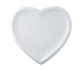 white plate in shape of heart isolated on white