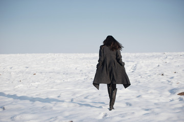 beautiful girl alone in winter field