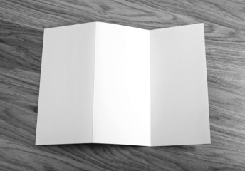 Blank folding page booklet on wooden background