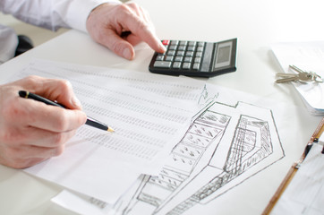 Realtor analyzing financial planning of a house