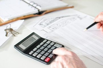 Realtor analyzing financial planning of a house