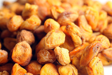 Dried apricots with pits in
