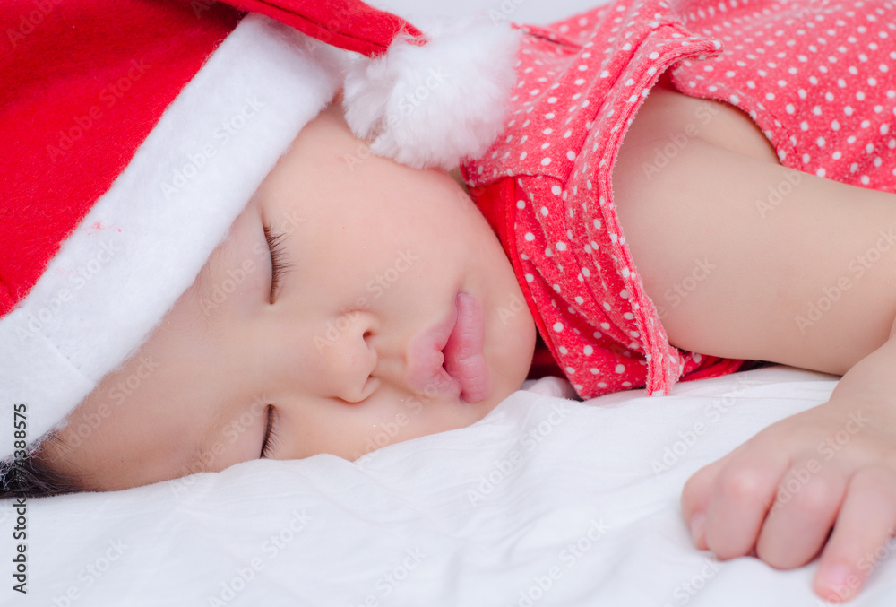 Wall mural Sleeping baby girl Santa Claus