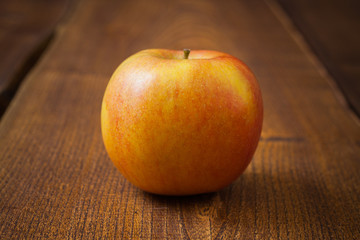 Apple fruit on dark wooden table