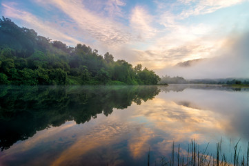 Sunrise by the lakeside with beautiful reflection