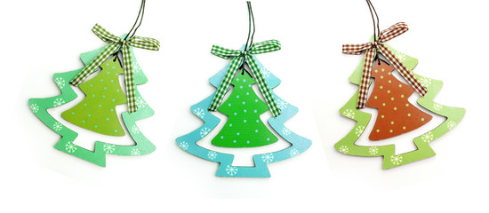 three wooden toy Christmas tree on a white background