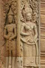 Fototapeta na wymiar Stone carving at Prasat Sikhoraphun temple, Surin, Thailand.
