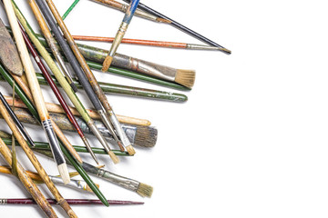pile of thrown down old brushes, isolated on white